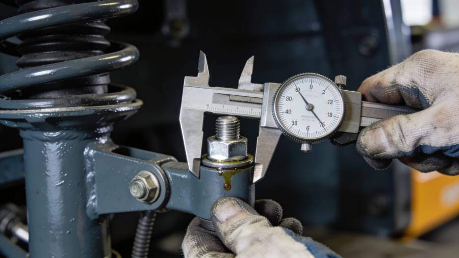 Related Image: A certified mechanic using a torque wrench to tighten the mounting bolts of a newly installed forklift shock absorber